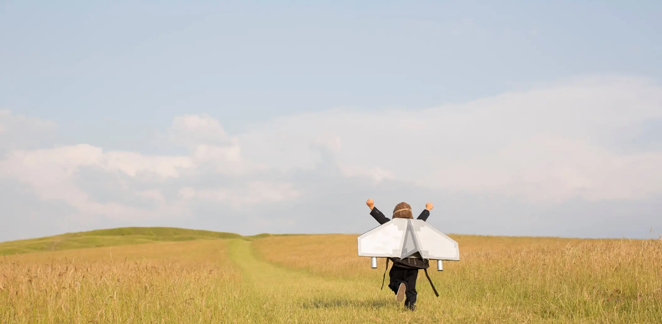 An image of a child running through open fields, set free in the happy knowledge that her web estate is well managed by a trusted partner.