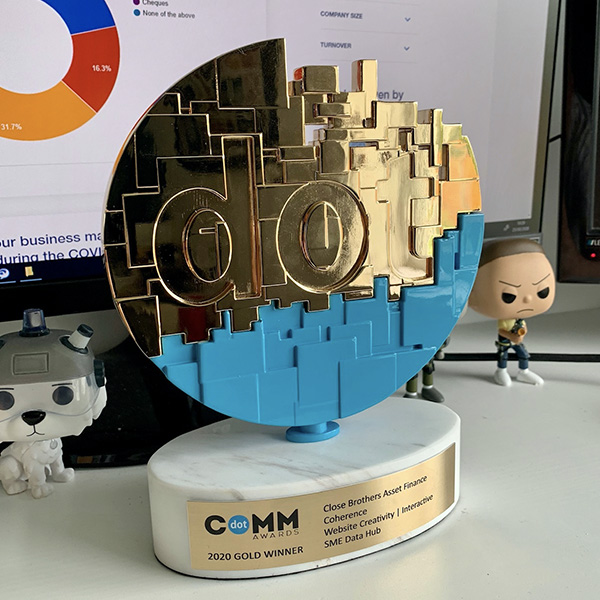 DotComm Gold Award on desk